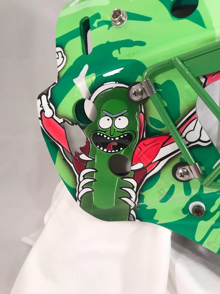 A green helmet with rick and morty on it