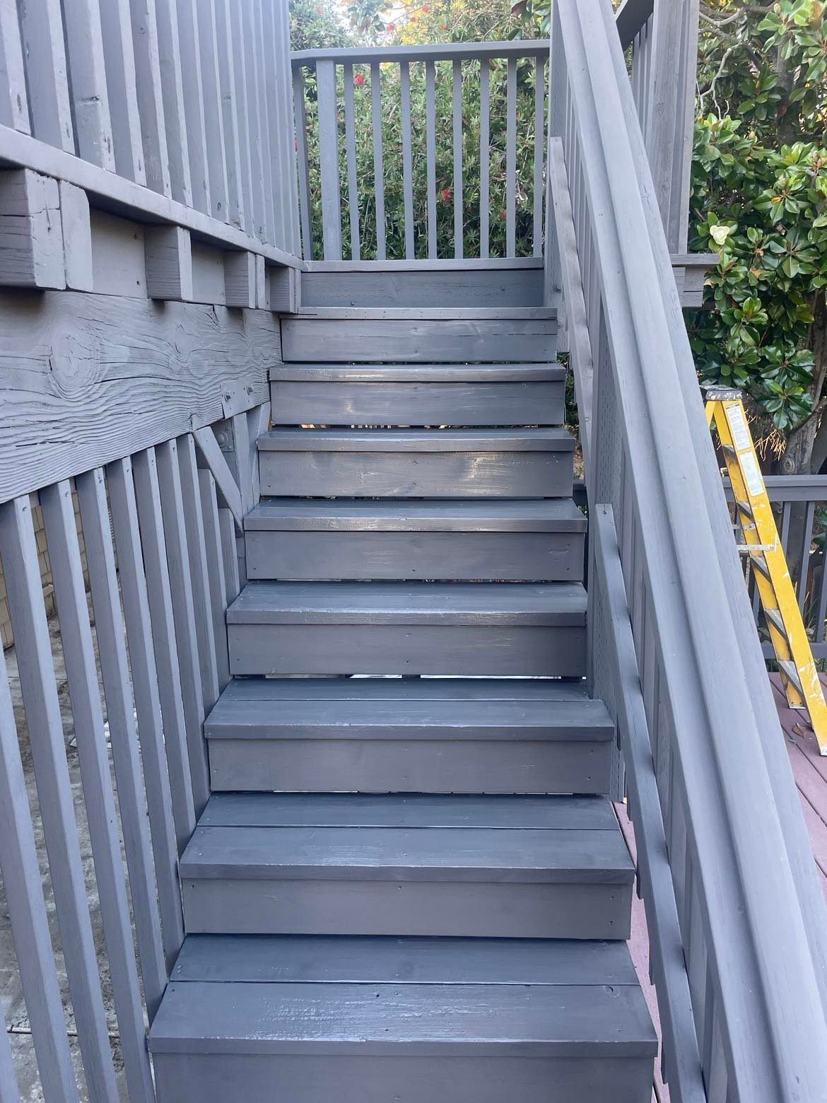 Gray wooden outdoor staircase.