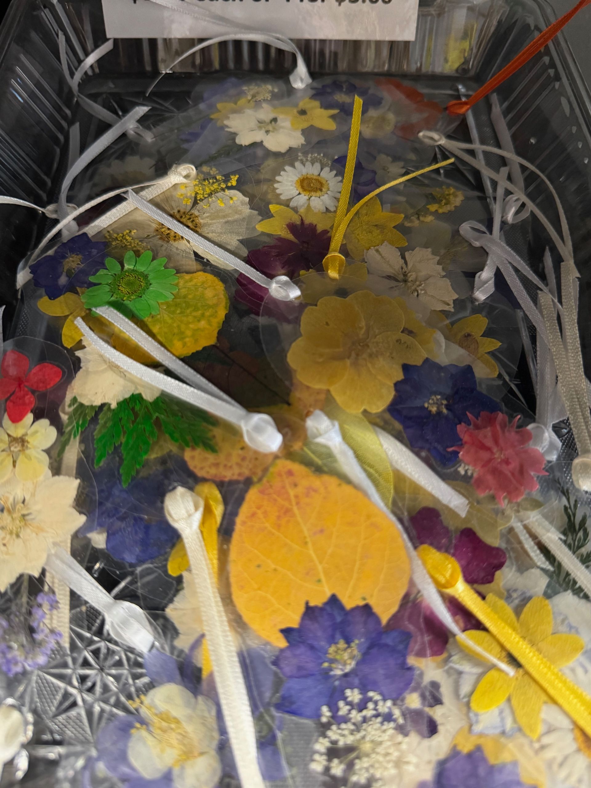 A bunch of flowers and leaves in a plastic bag
