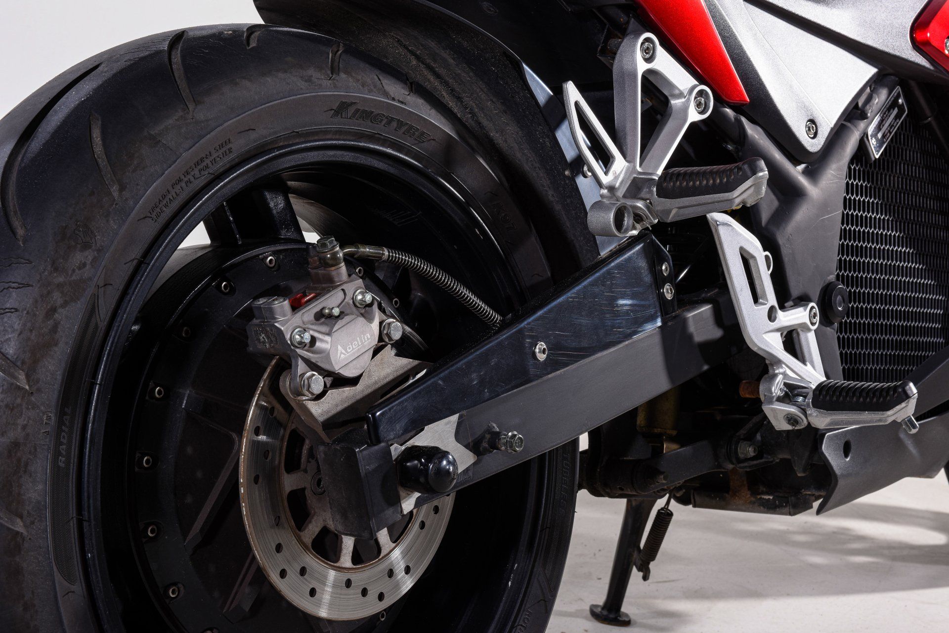 A close up of the rear wheel of a motorcycle