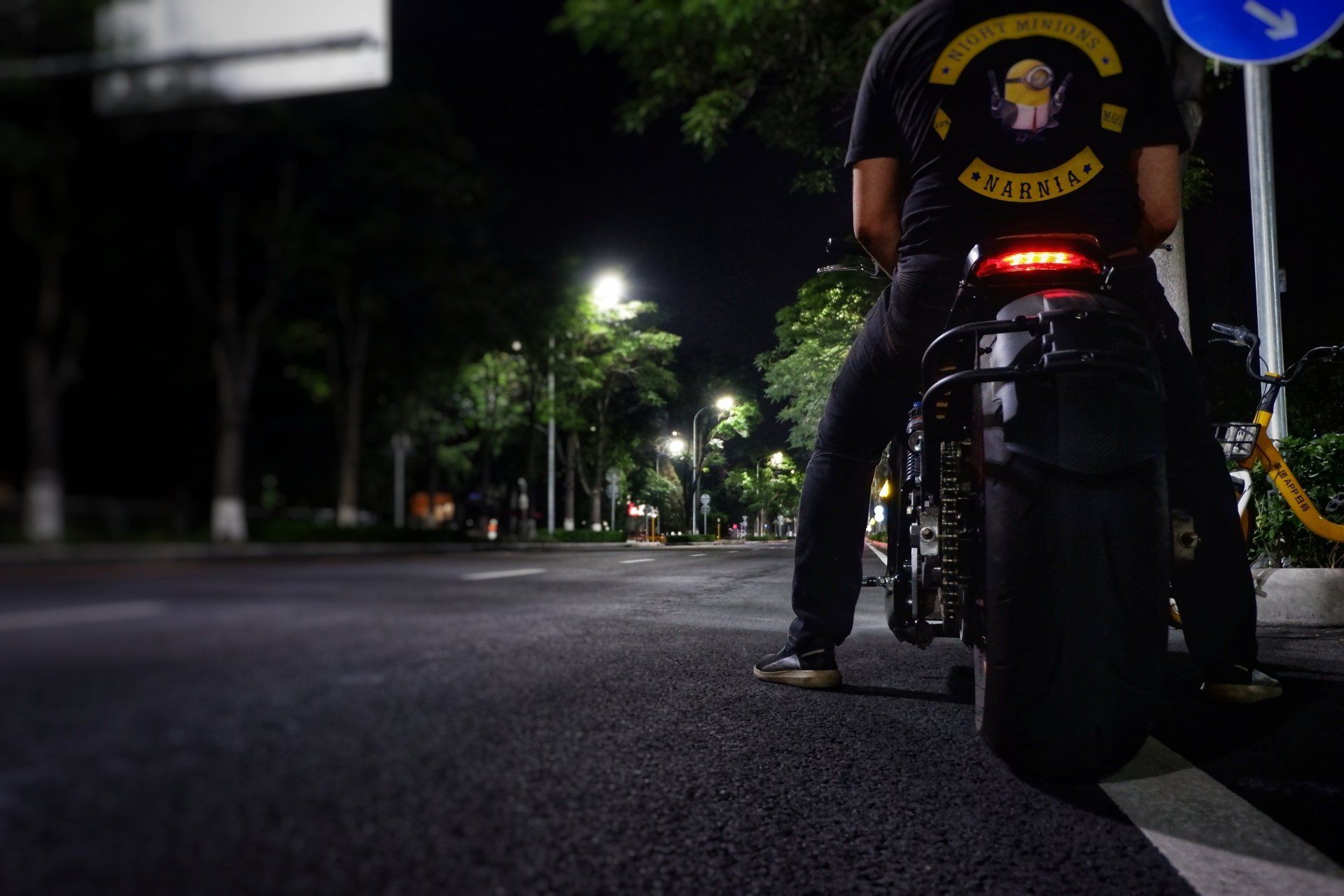 Sebastian Chrobok is riding 6061-GT an electric motorcycle down a street at night.