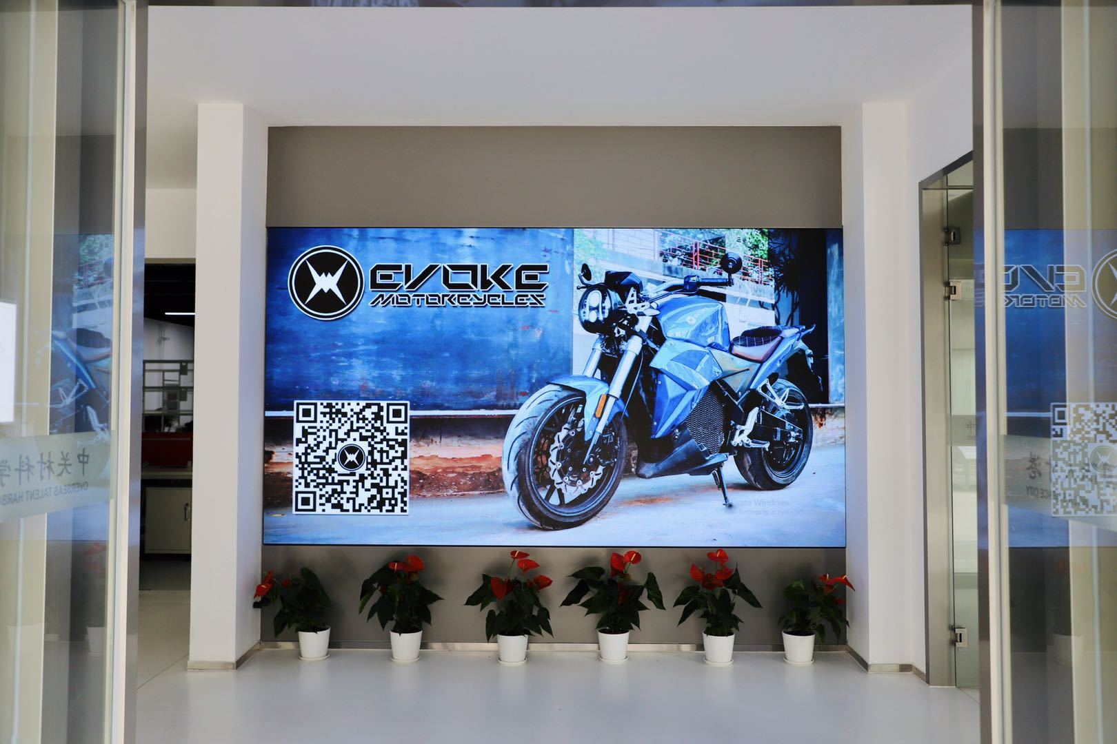 A motorcycle is displayed on a wall in a room.