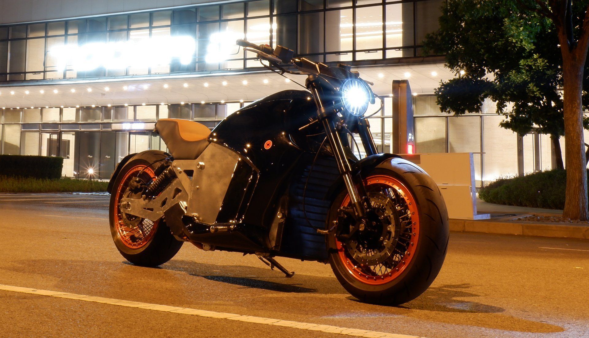 A 6061-GT electric motorcycle is parked in front of a building at night New York, USA 2022
