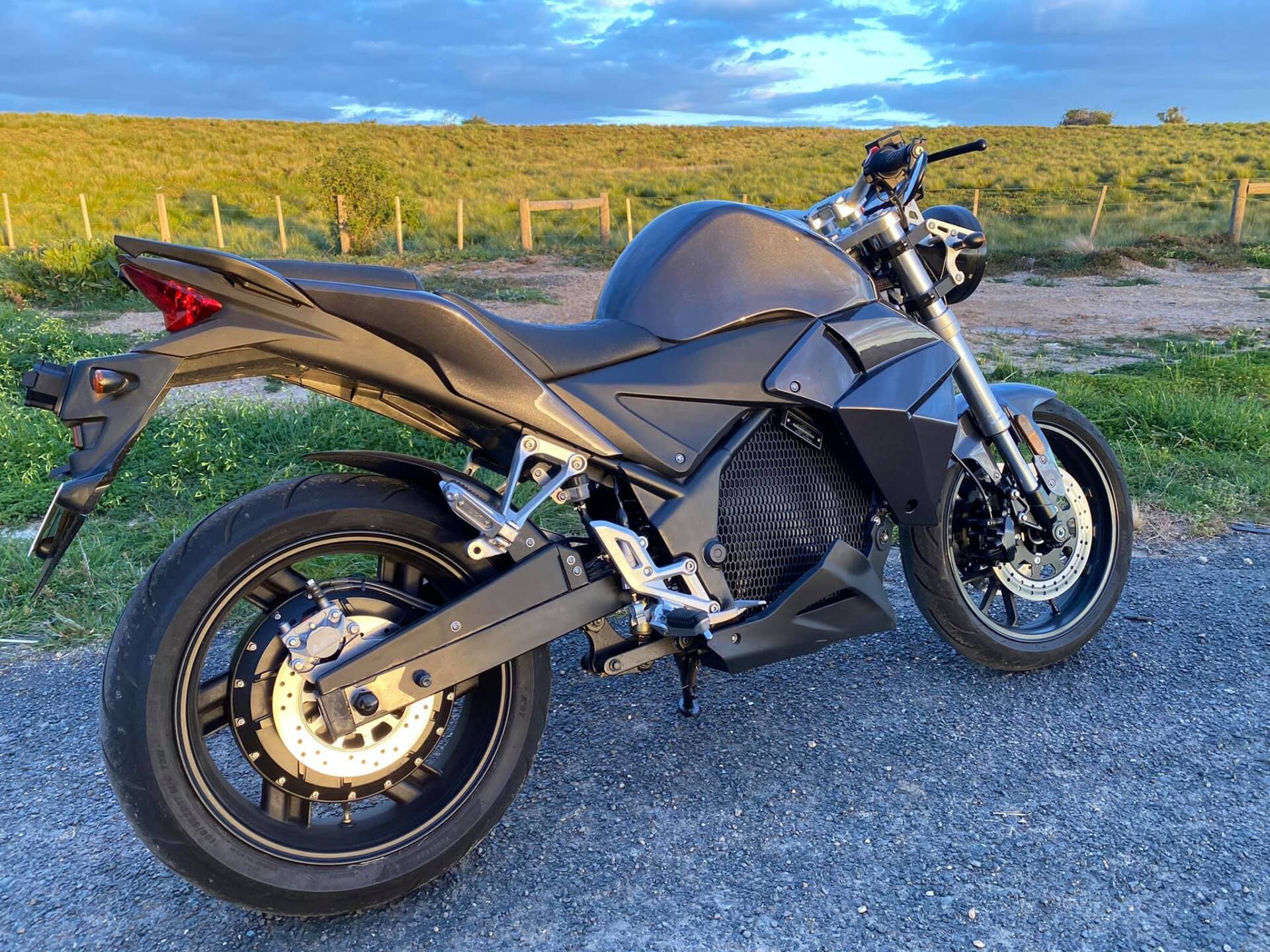 Urban Classic in black, an electric motorcycle is parked on the side of the road in Perth, Australia