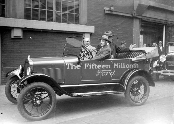 A black and white photo of the fifteen millionth ford