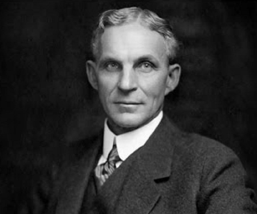 A black and white photo of a man in a suit and tie.