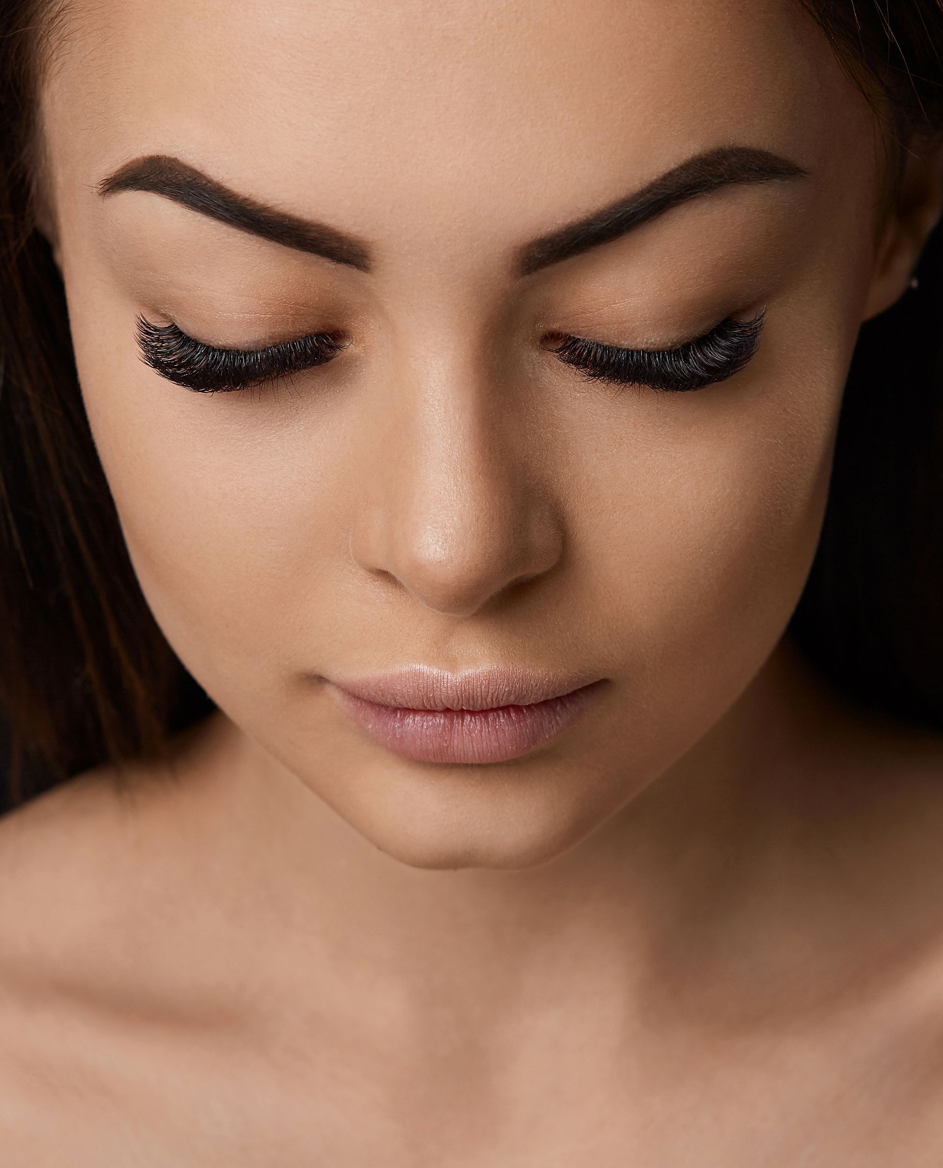 a close up of a woman 's face with her eyes closed