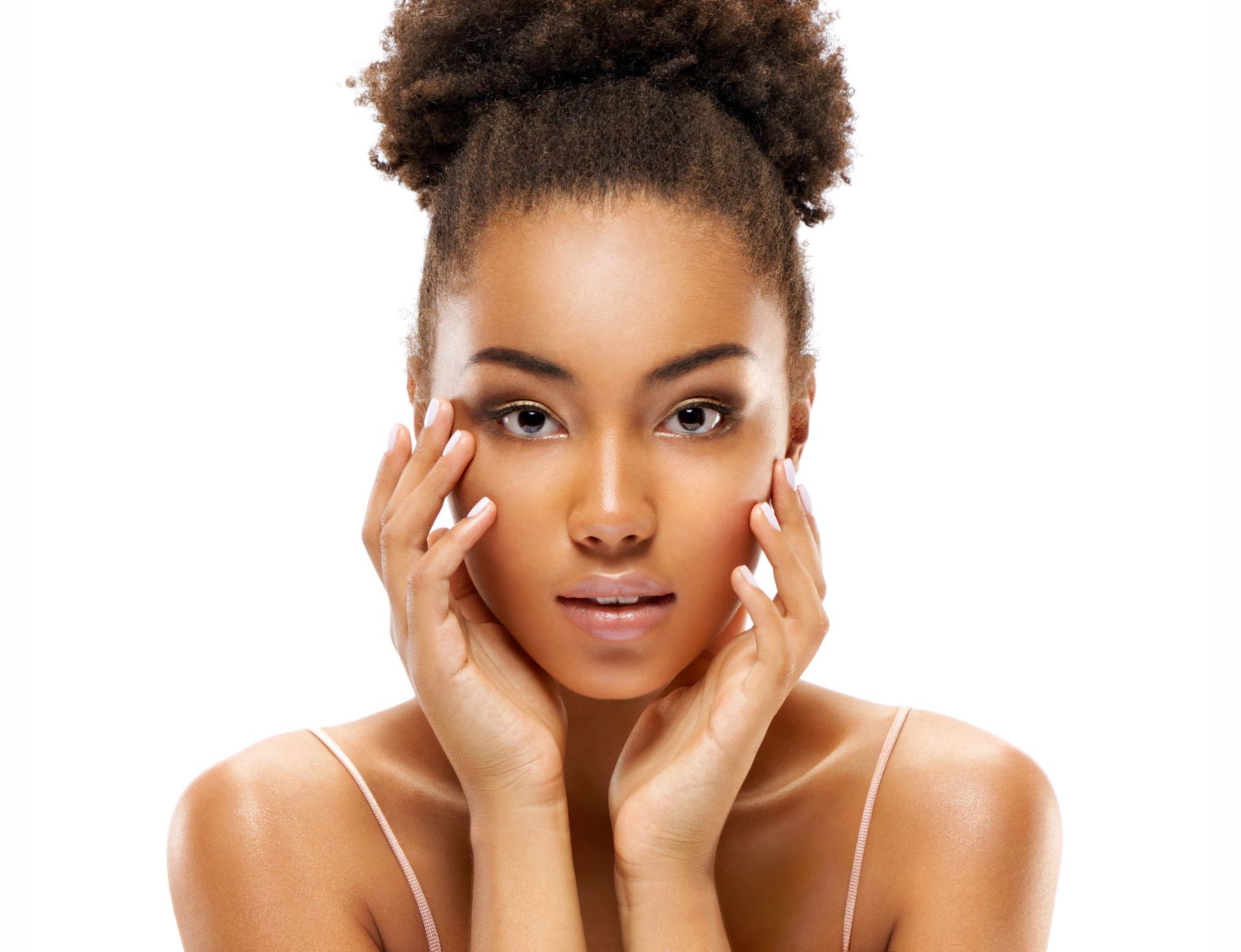 a woman with her hands on her face looks at the camera