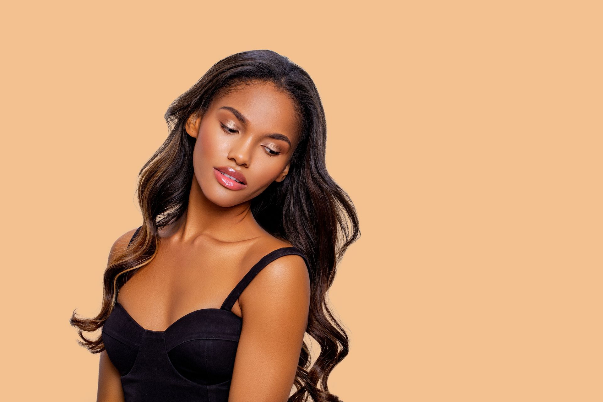 a woman with long hair is wearing a black bra