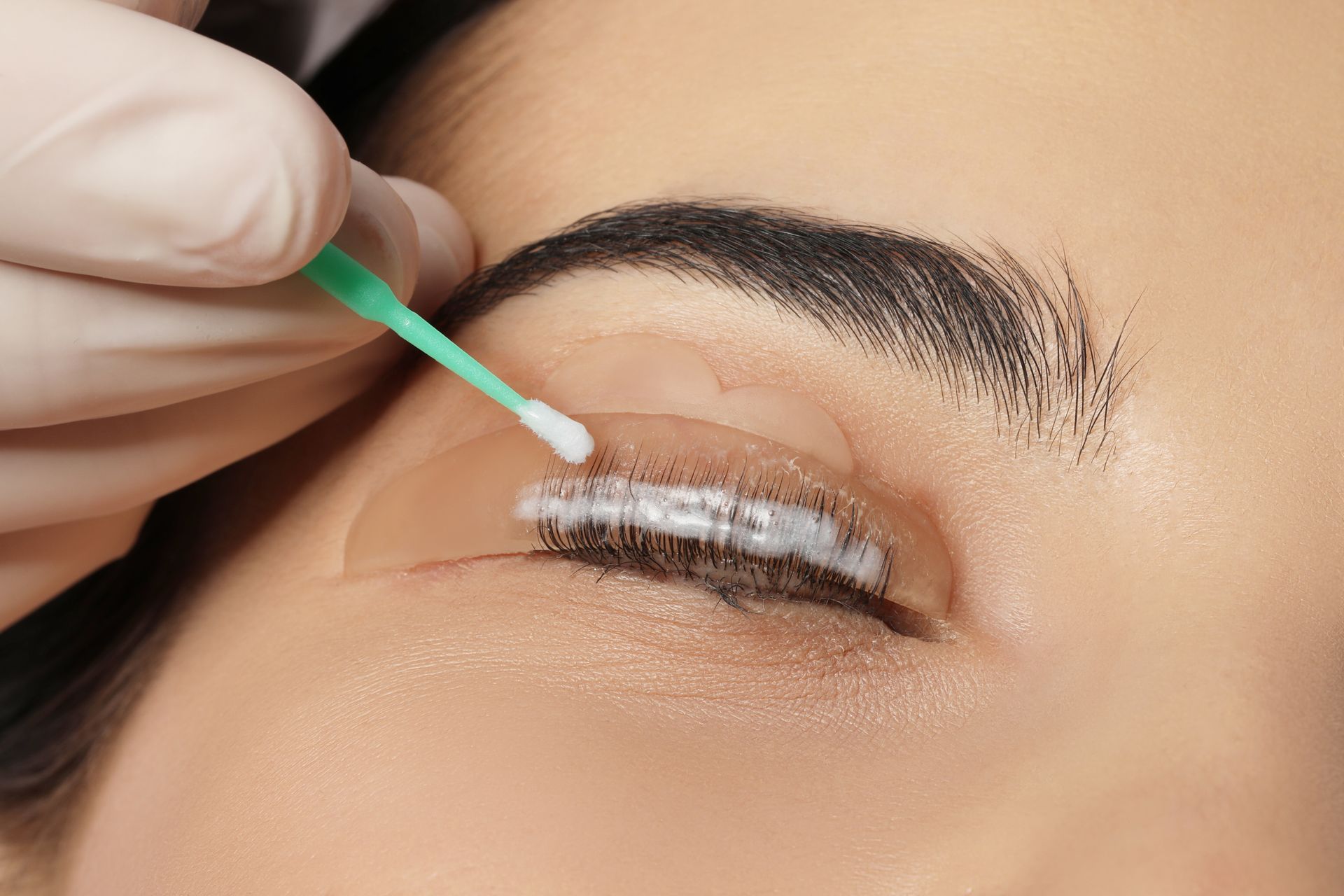 a close up of a woman getting a lash lift