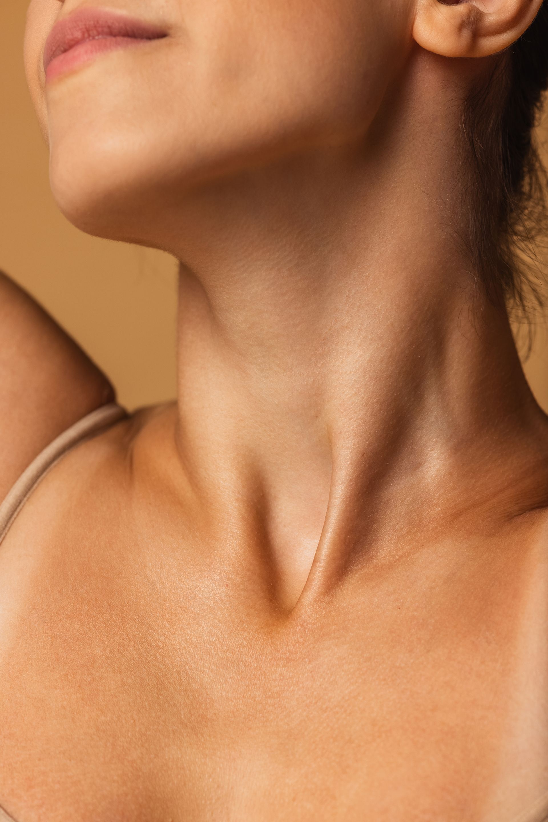 a close up of a woman 's neck and chest