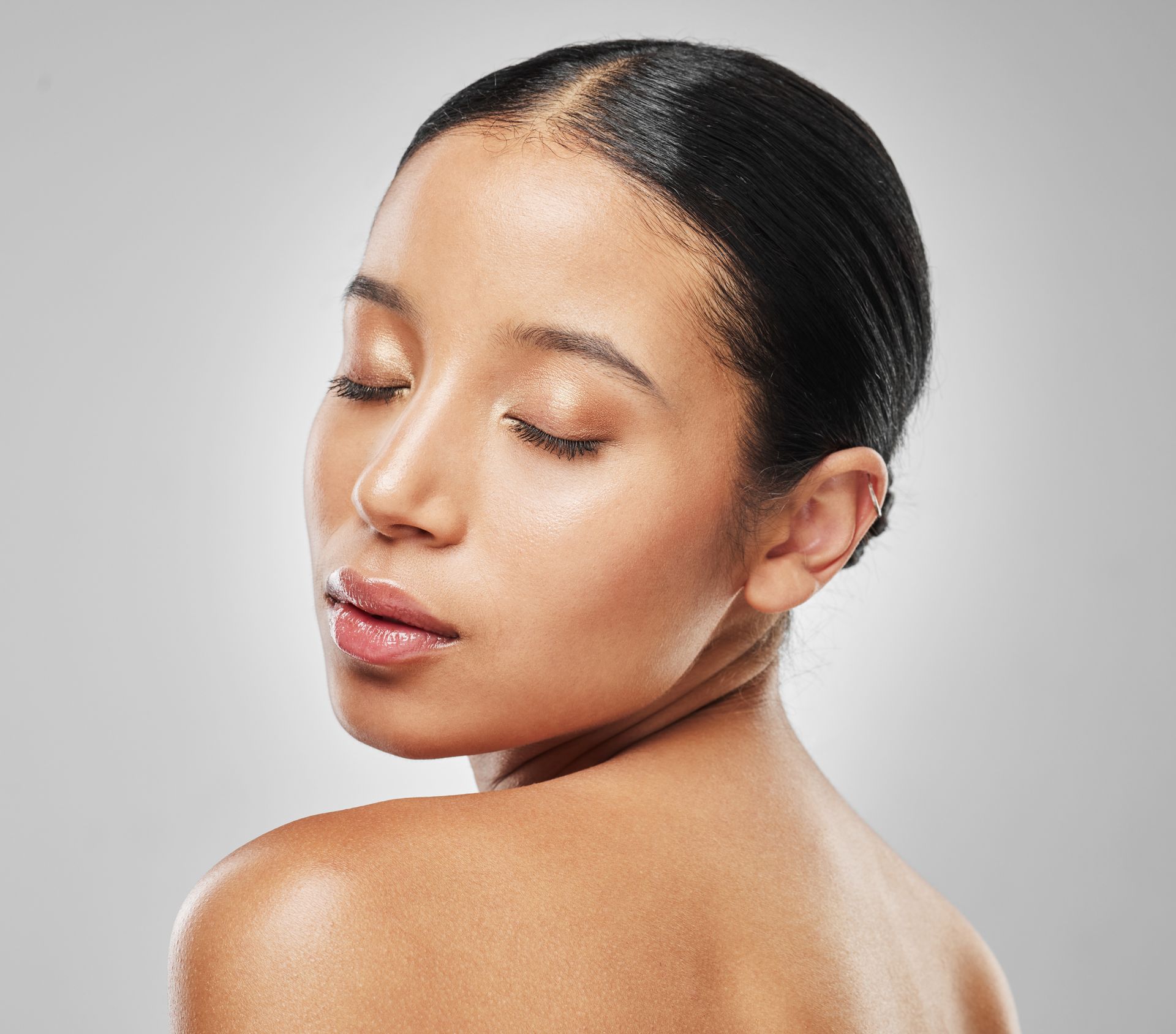 a close up of a woman 's face with her eyes closed