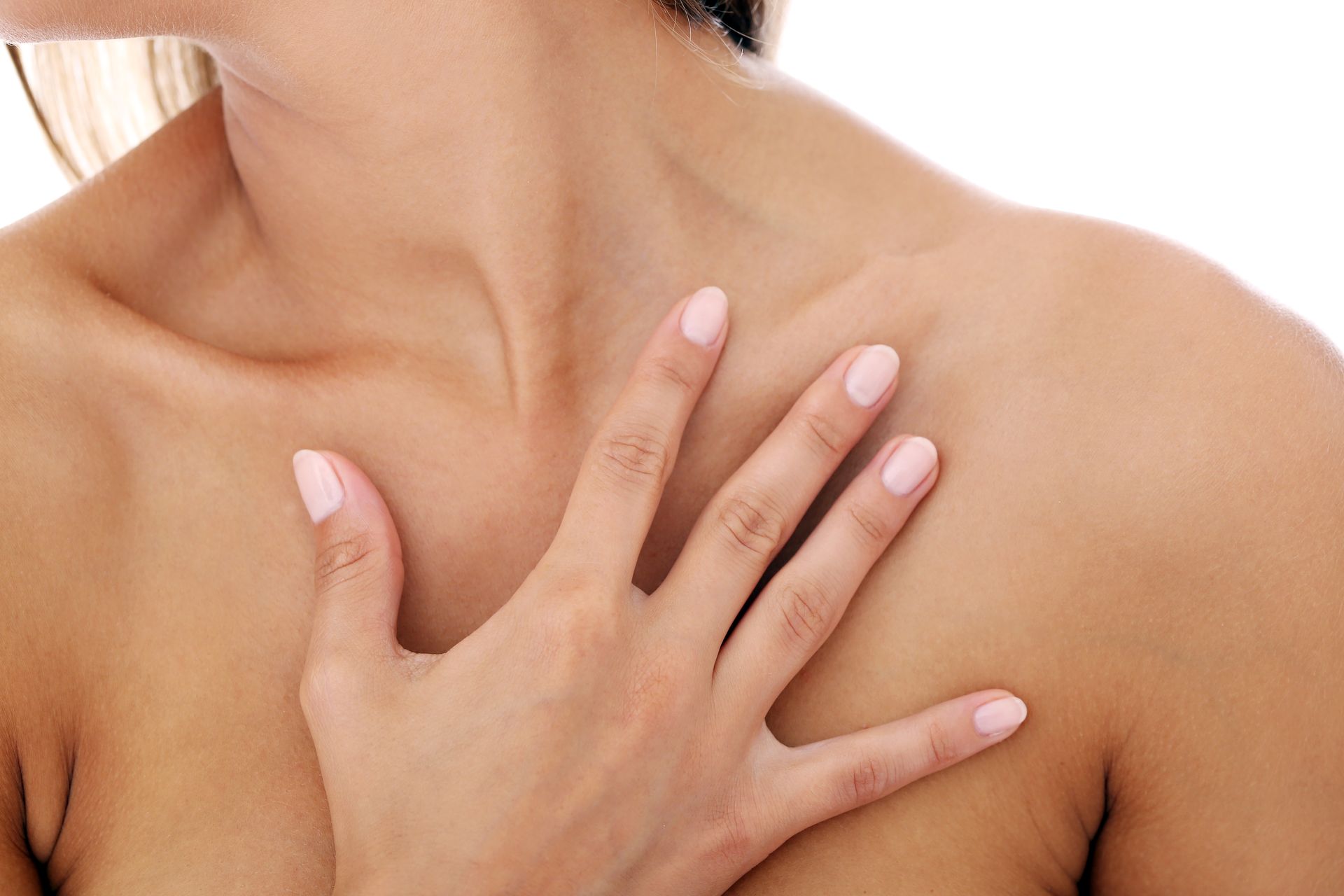 a woman with her hand on her chest