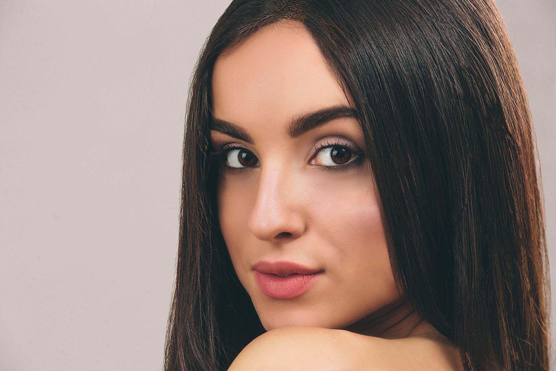 a close up of a woman 's face with long hair
