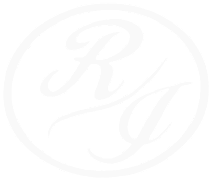 A white logo with the letter r in a circle on a white background Richland inn of Columbia.