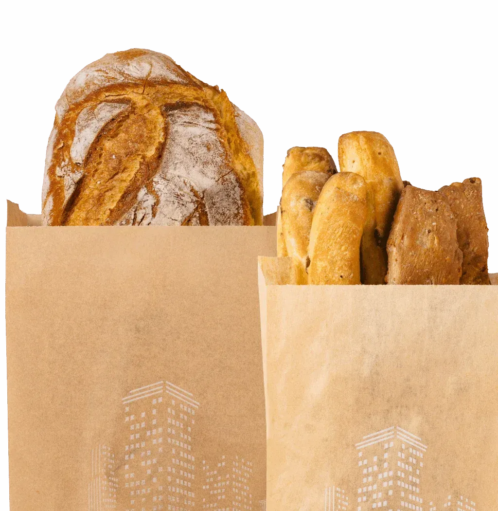 Due sacchetti di carta contenenti pane e pasticcini su sfondo bianco.