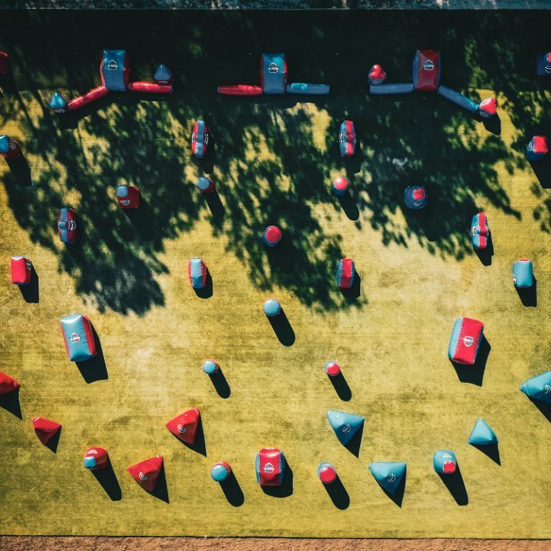 An aerial view of a field of paintball markers