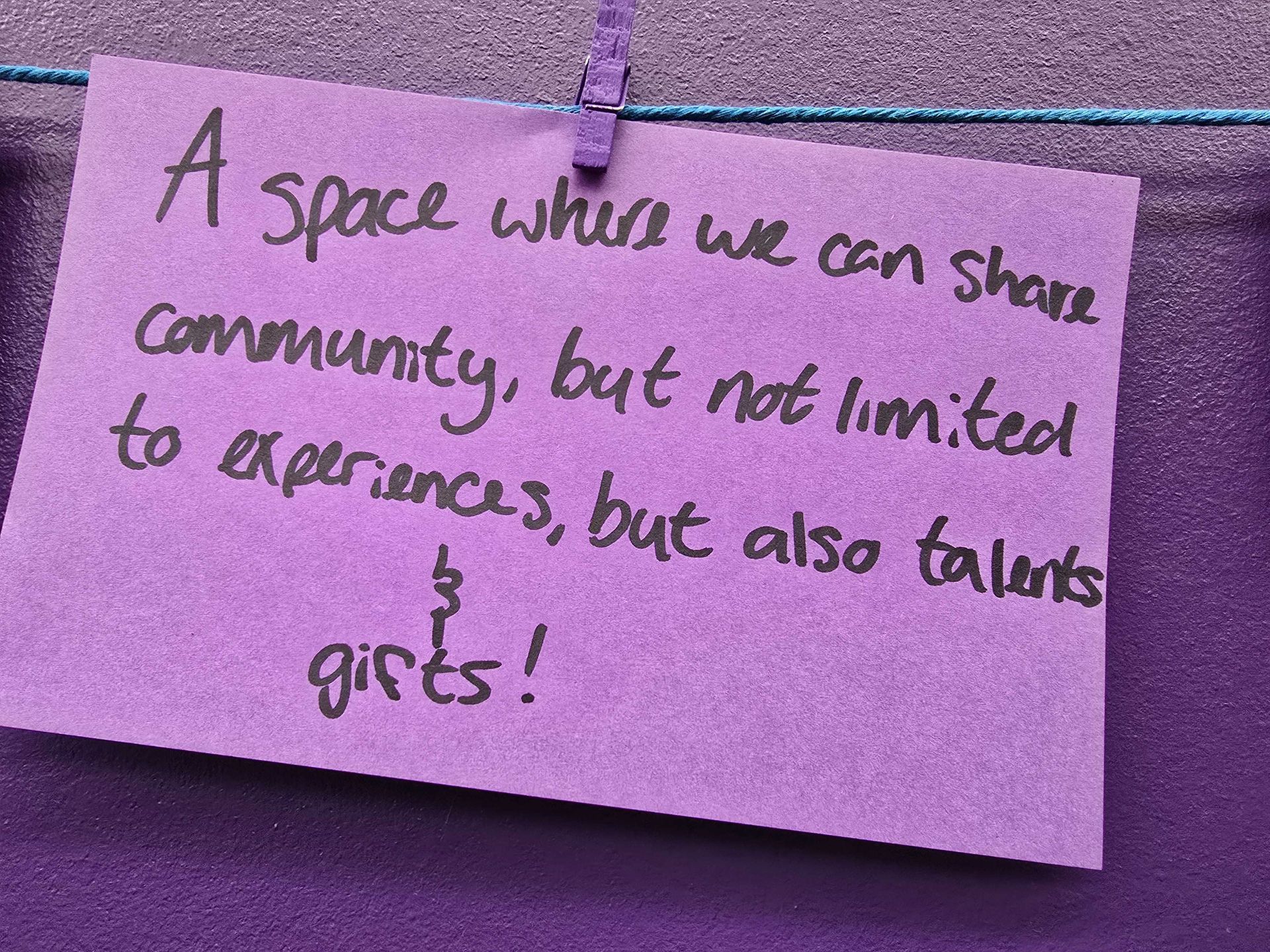 Purple note with black handwriting: