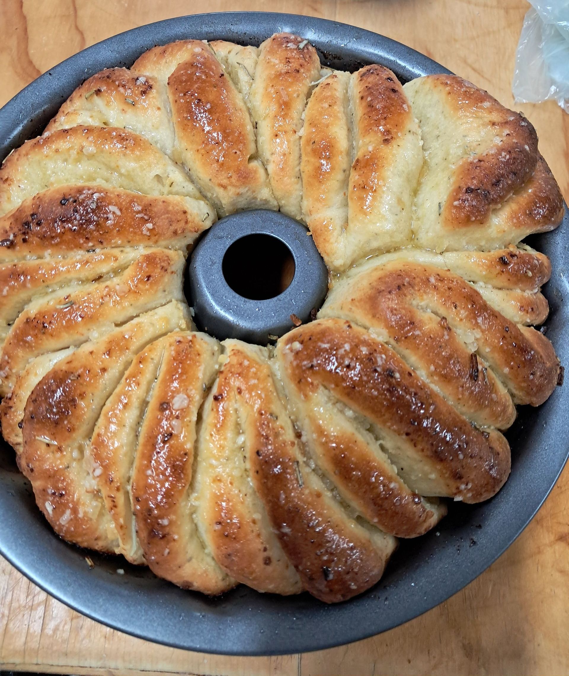 Garlic Wreath layers of garlic bread smothered in butter in a round tin