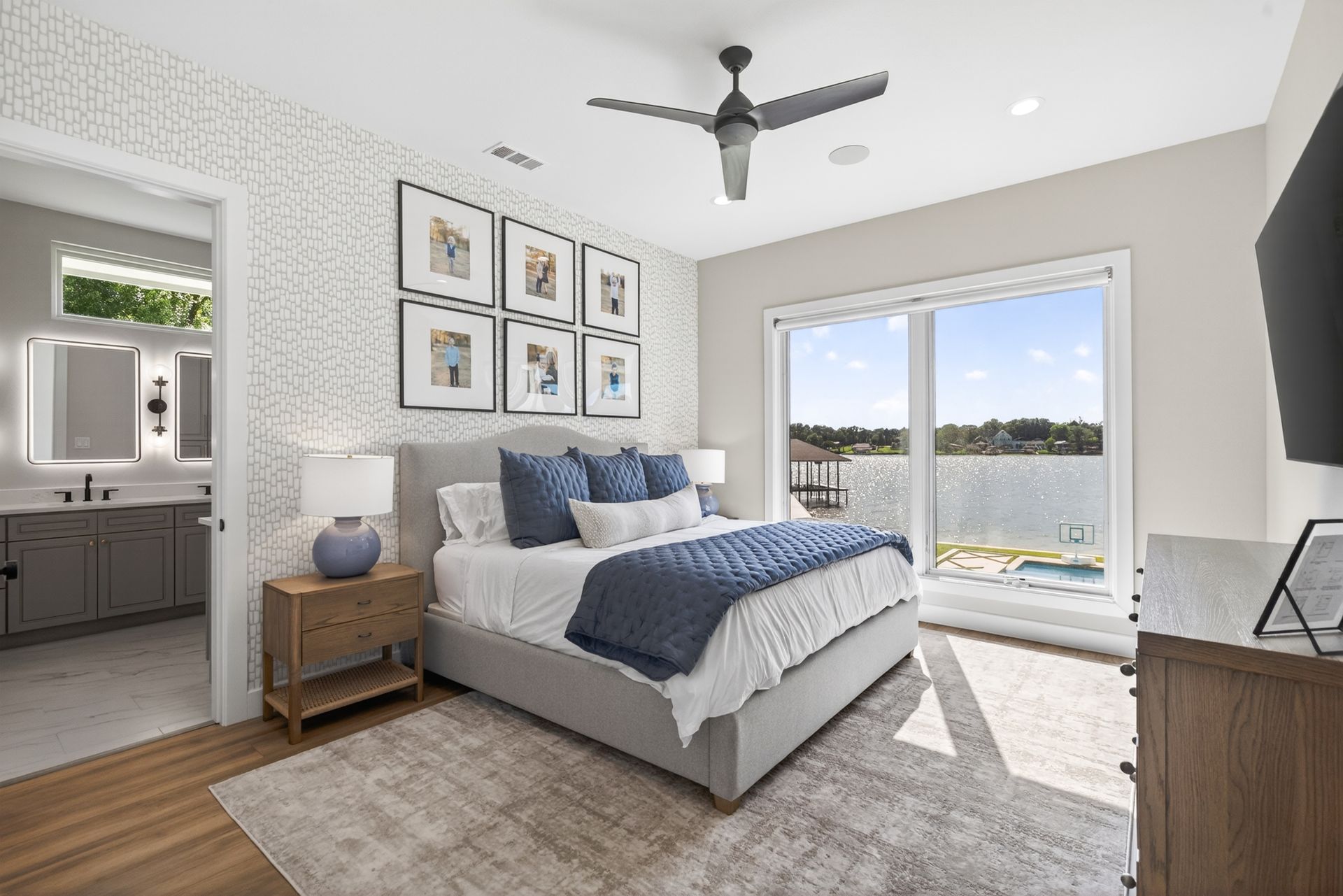 Bright modern bedroom with a king bed, ocean view, and neutral decor