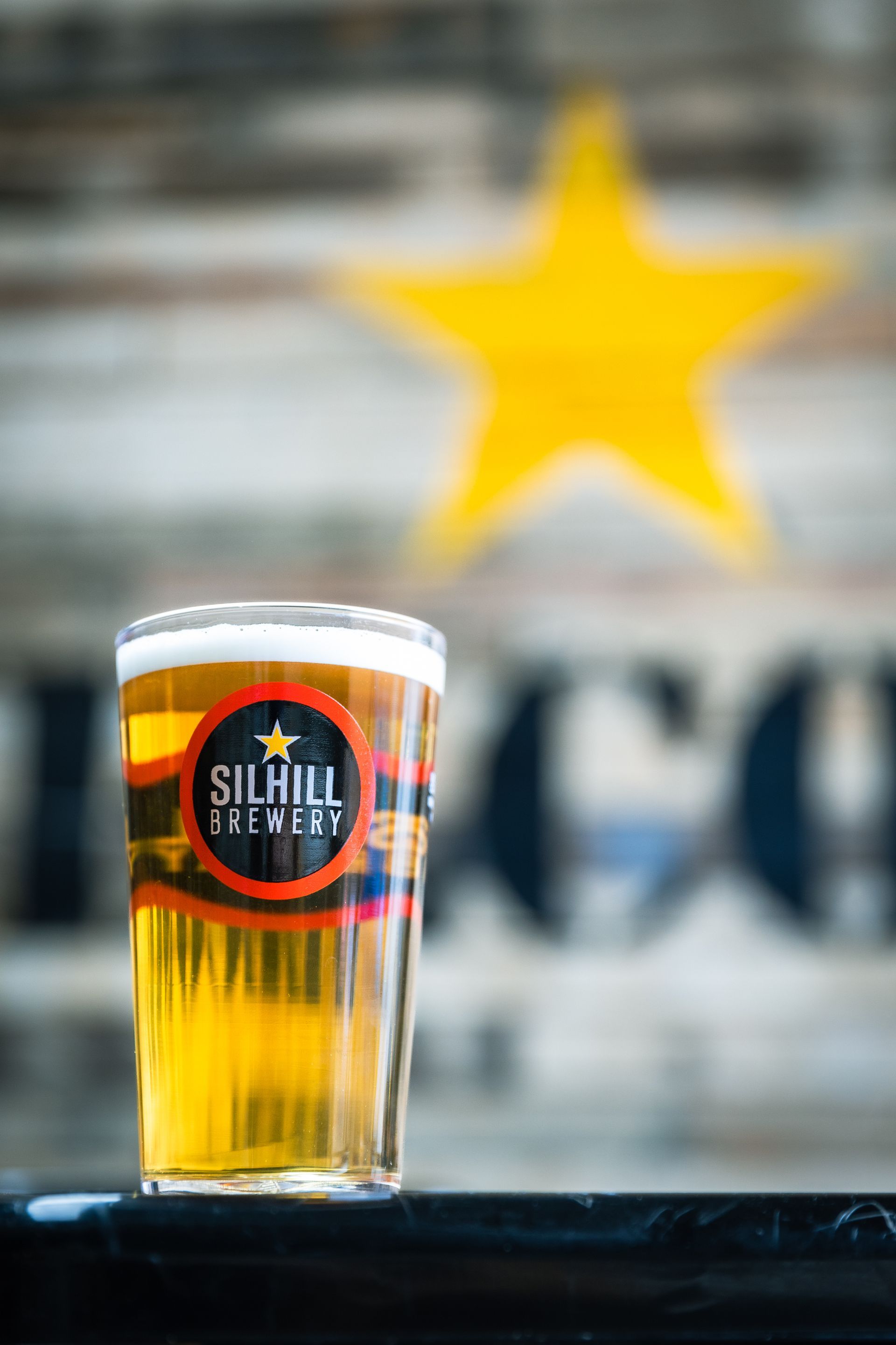 A glass of beer with silhill brewery written on it
