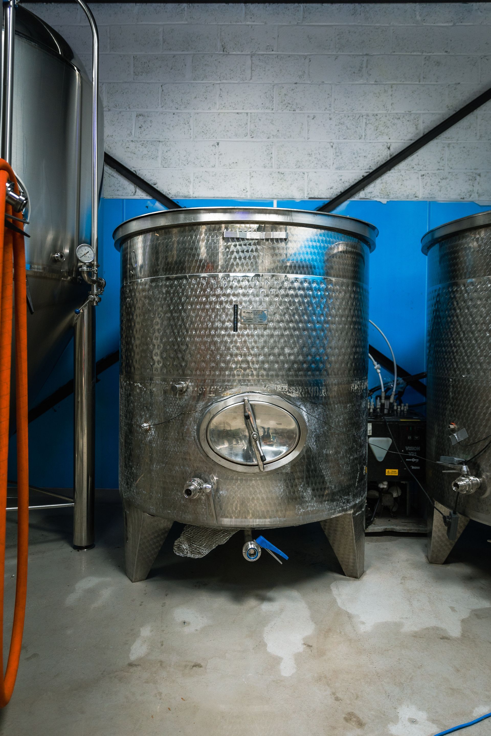A stainless steel tank with the number 1 on it