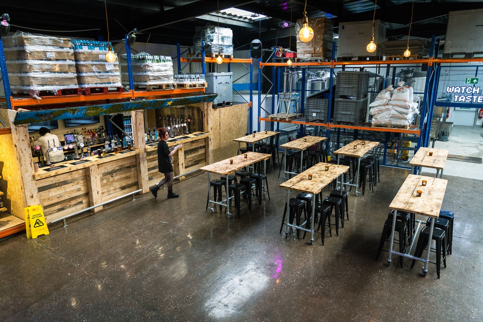A large room with lots of tables and chairs in it