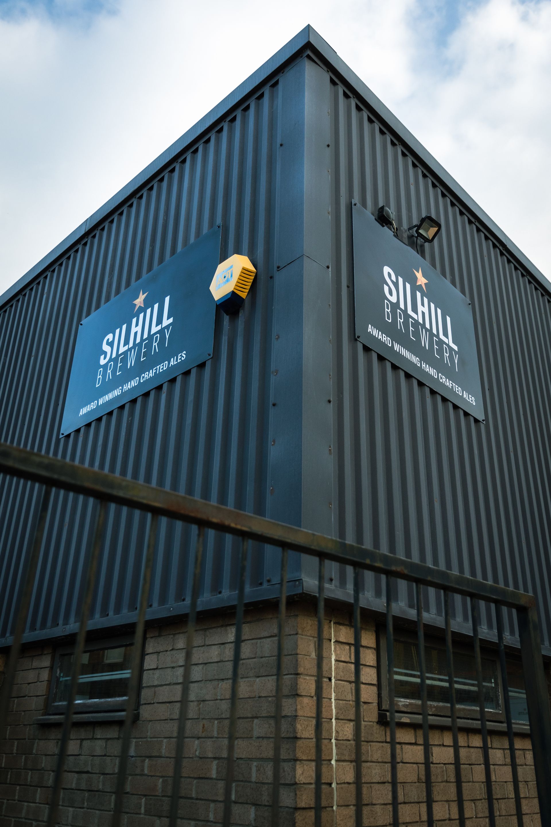 A building with a sign that says silhill brewery on it