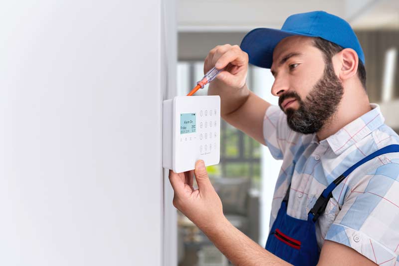 Installing Home Security System — Islington, NSW — Adtech Security Electric Services Installing Home Security System — Islington, NSW — Adtech Security Electric Services