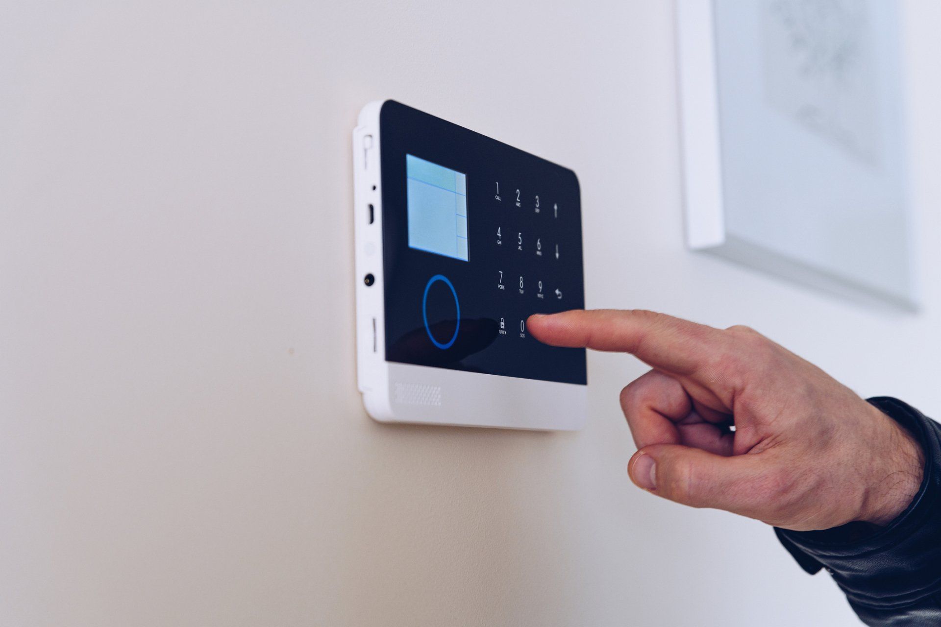 Man Unlocking The Alarm In The Apartment — Islington, NSW — Adtech Security Electric Services