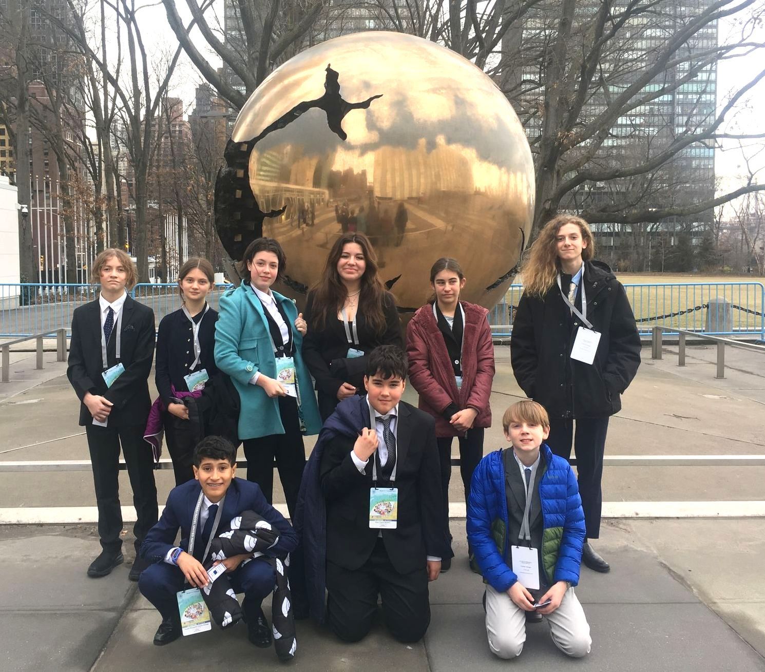 A group of Middle Schoolers standing in front of bronze statue in New York City. The students visited for Montessori Model United Nations (MMUN).