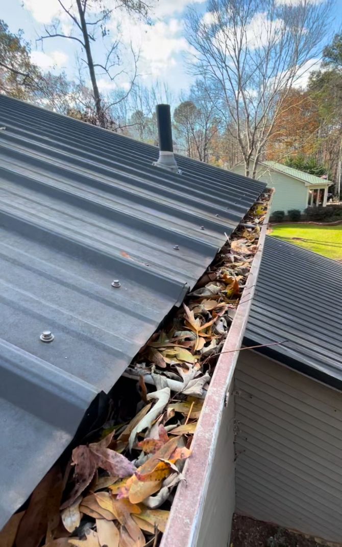 Gutter cleaning service by Dead Silent Lawn Care preventing water damage.