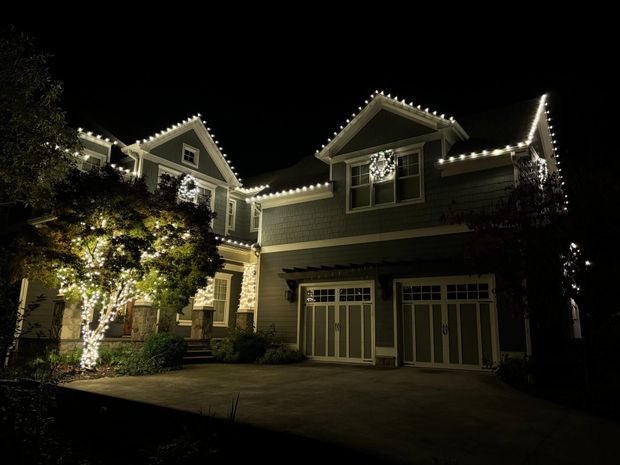 Festive home transformed with professional holiday lighting services.