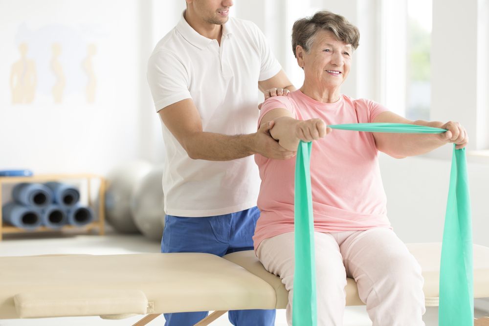 A Healthcare Professional Assists a Patient in a Clinic — Elevate Injury Management in Sandy Bay, TAS