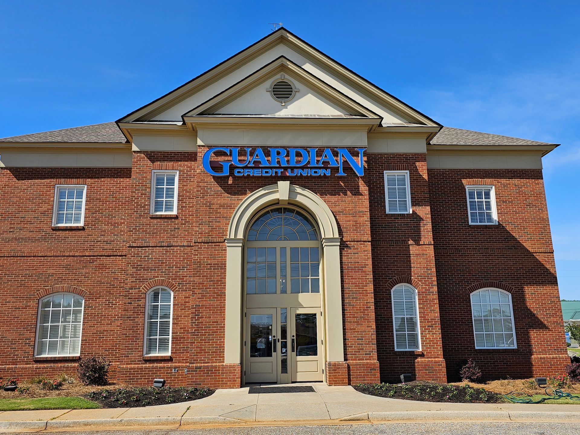 A brick building with the word guardian on it