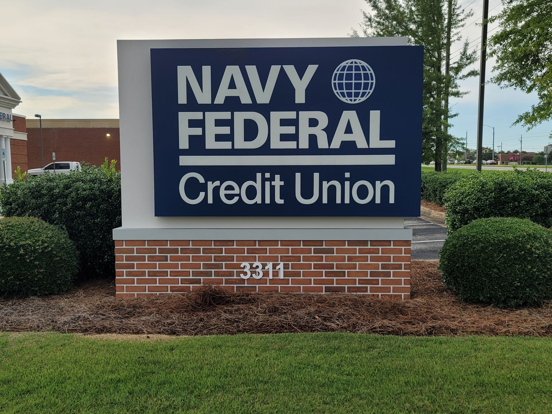 A navy federal credit union sign in front of a building