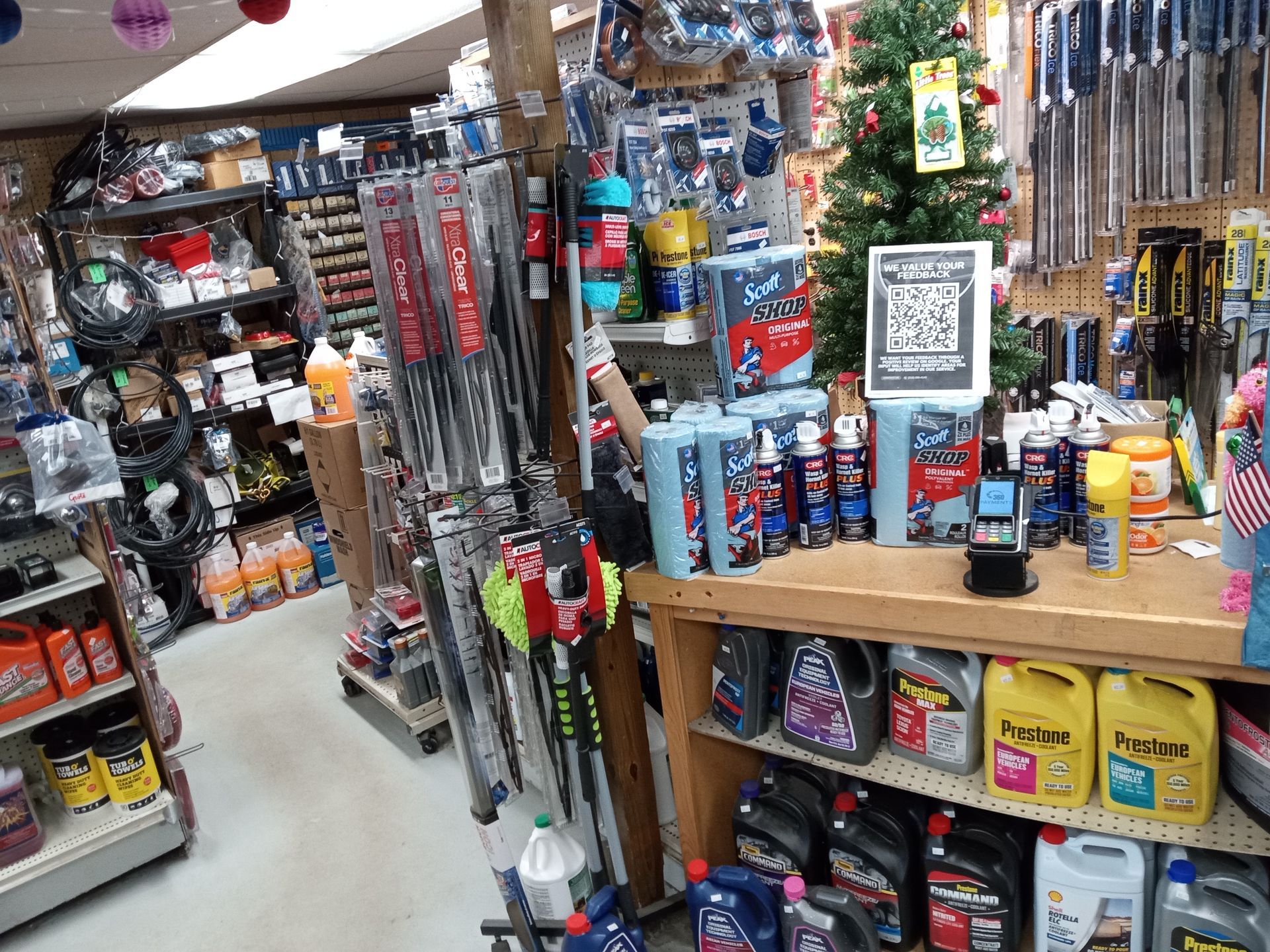 A car parts store with a christmas tree in the background