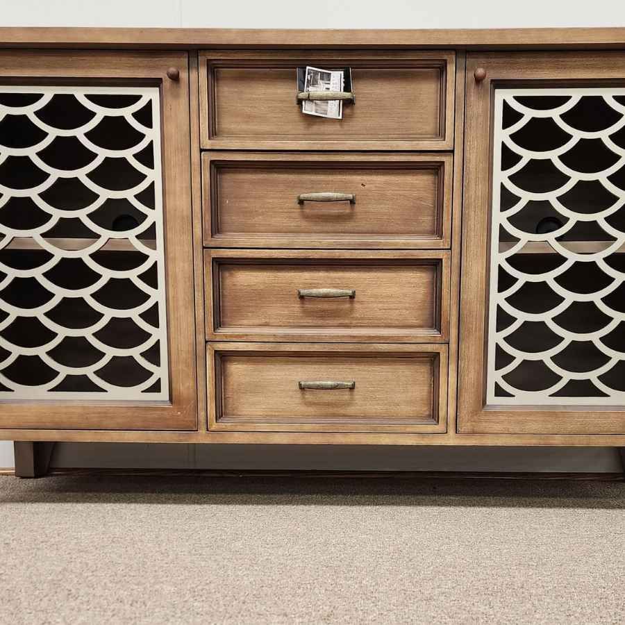 Wooden mid-century cabinet with four drawers and lattice doors on a beige carpet