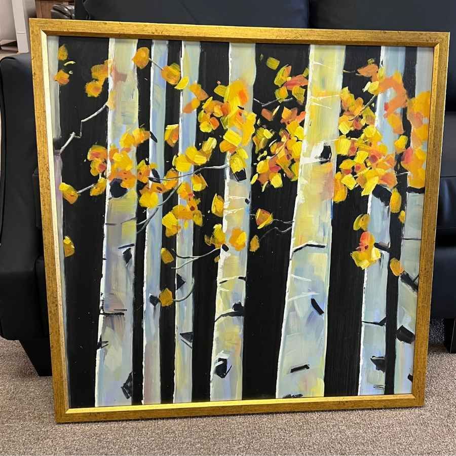 Framed painting of white birch trees with yellow-orange autumn leaves against a dark background