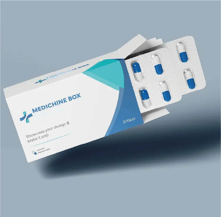 Caja de medicamentos azul y blanca con blíster de pastillas sobre un fondo gris.