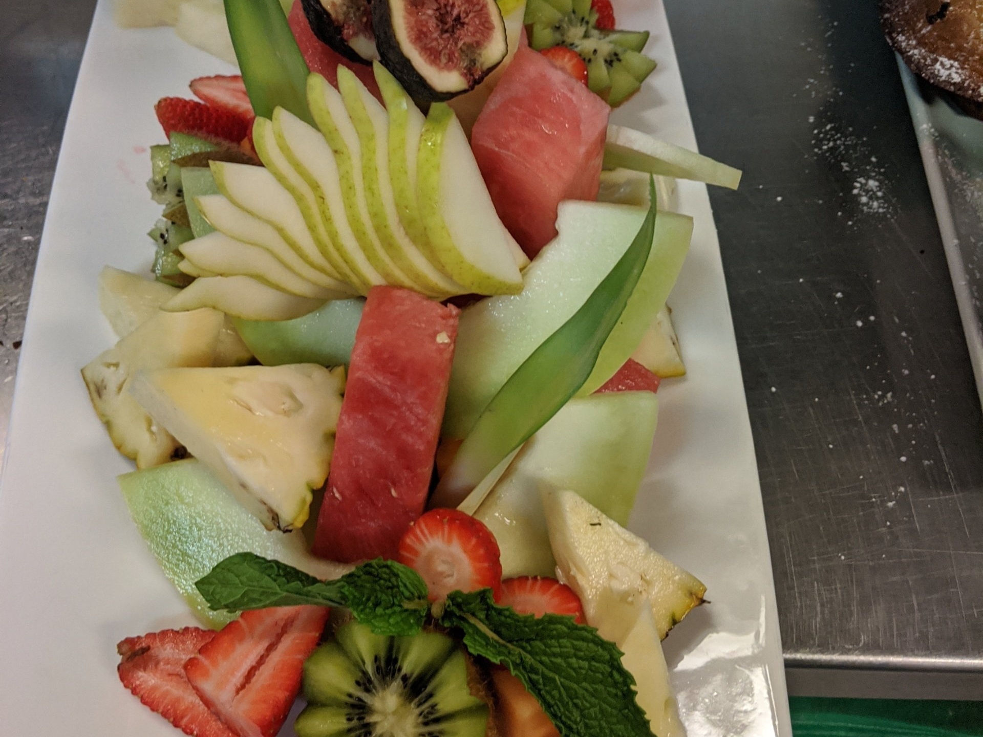 person eating a bowl of salad