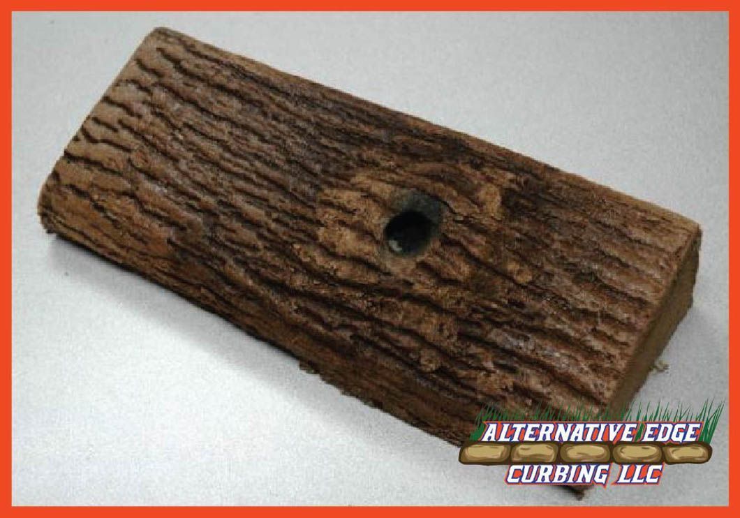 Log-shaped decorative furring piece with a hole, in shades of brown with an orange border.