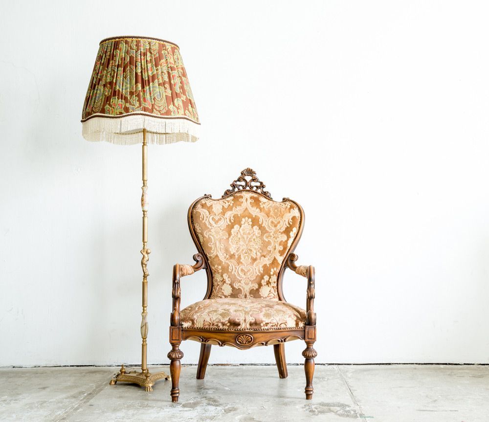 A Chair Is Sitting Next To A Lamp In A Room — Coastal Upholstery In Berkeley Vale, NSW