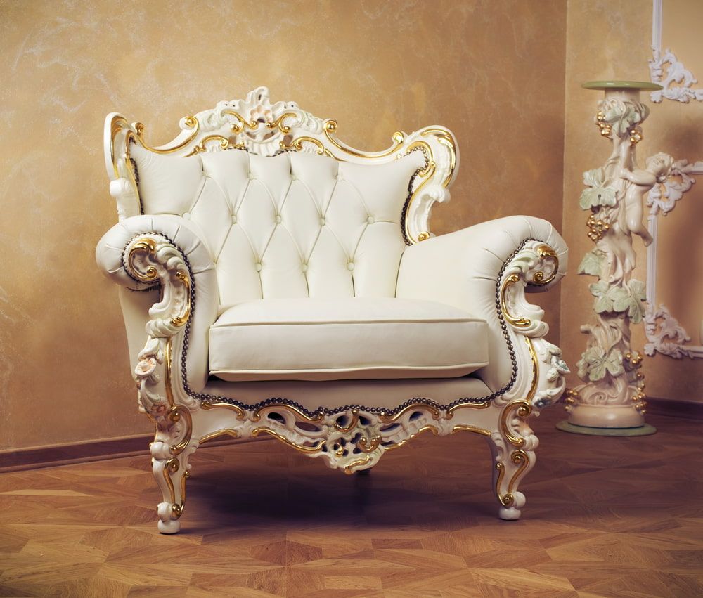 A White Chair With Gold Trim Is In A Room — Coastal Upholstery In Berkeley Vale, NSW