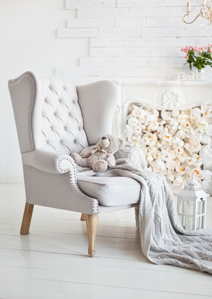 A Chair With A Teddy Bear Sitting On It In A Living Room — Coastal Upholstery In Berkeley Vale, NSW
