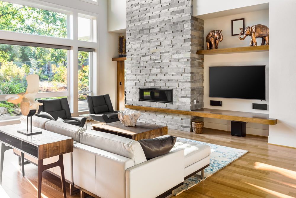 A Living Room With A Couch, Chairs, Television And Fireplace — Coastal Upholstery In Berkeley Vale, NSW