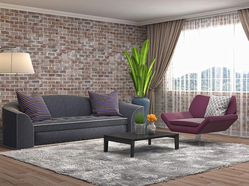 A Living Room With A Couch, Chair, Coffee Table And Rug — Coastal Upholstery In Berkeley Vale, NSW