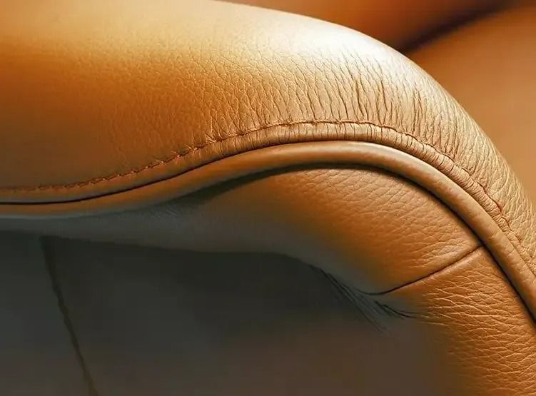 A Close Up Of The Arm Of A Brown Leather Couch — Coastal Upholstery In Berkeley Vale, NSW