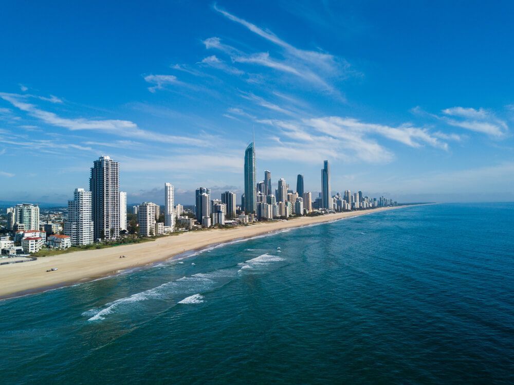 An Aerial View Of A City Skyline Overlooking The Ocean — Dams Cleaned in Gold Coast, QLD