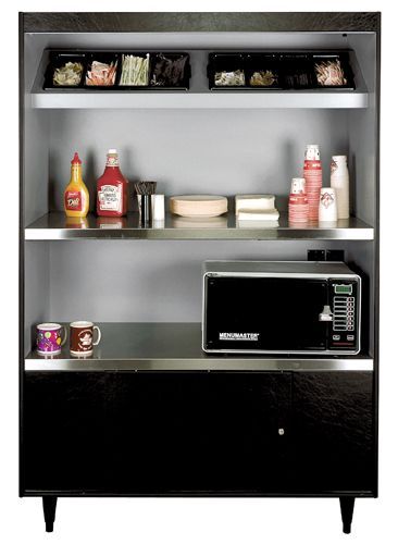 A stainless steel shelf with a microwave and condiments on it